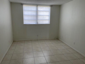 5961 NW 61st Ave, Unit 107 in Tamarac, FL - Building Photo - Building Photo