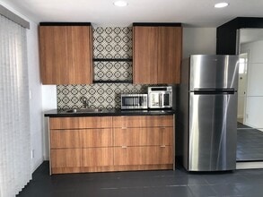 10655 Coraline Pl in Chatsworth, CA - Building Photo - Building Photo