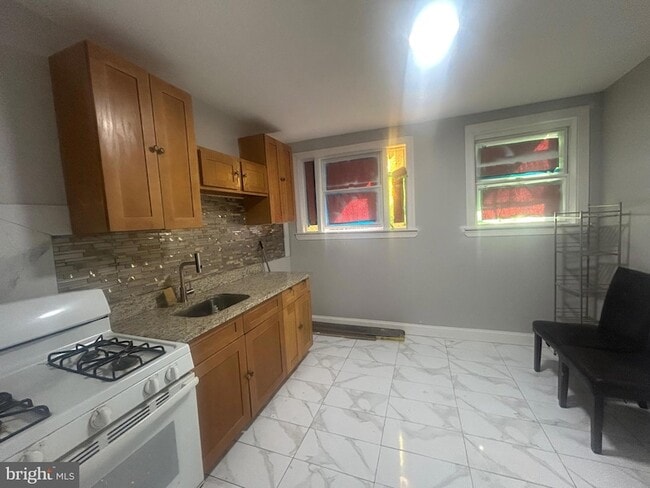 1432 Gilham St, Unit 01-120 in Philadelphia, PA - Building Photo - Building Photo