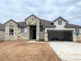 672 Wild Pecan Lp in Mustang Ridge, TX - Building Photo