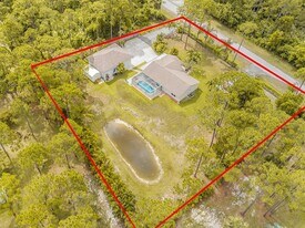 14155 86th Rd N in The Acreage, FL - Building Photo