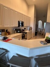 3960 Deer Crossing Ct, Unit 202 in Naples, FL - Foto de edificio - Building Photo