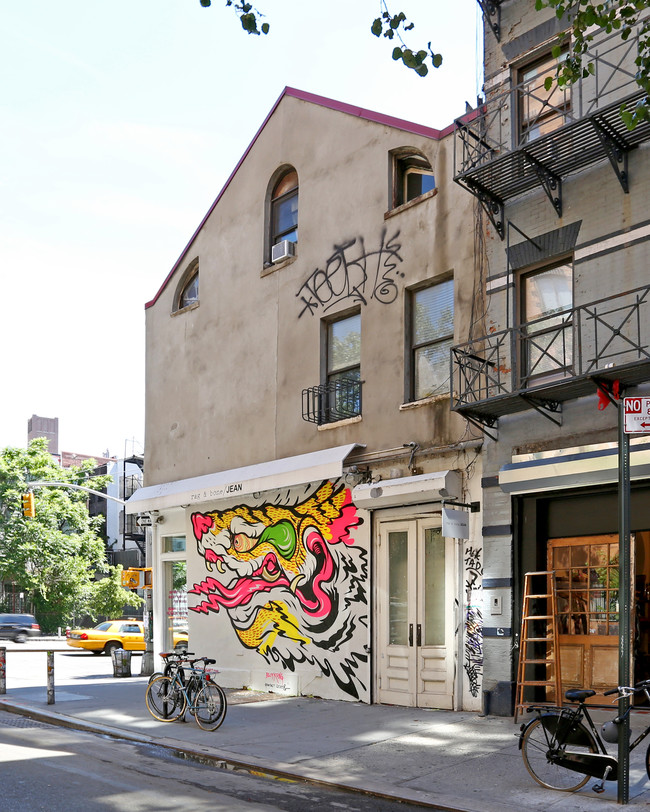 73-79 E Houston St in New York, NY - Building Photo - Building Photo