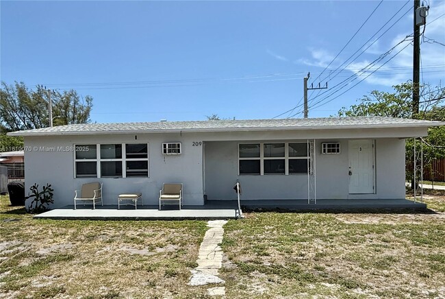 property at 209 SW 14th St
