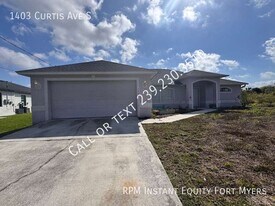 1403 Curtis Ave S in Lehigh Acres, FL - Building Photo