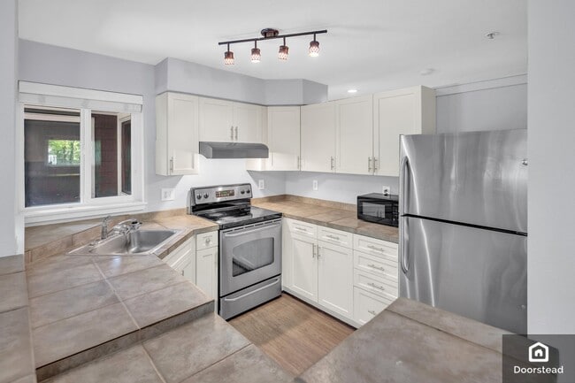 3908 243rd Pl SE, Unit Q 101 in Bothell, WA - Foto de edificio - Building Photo