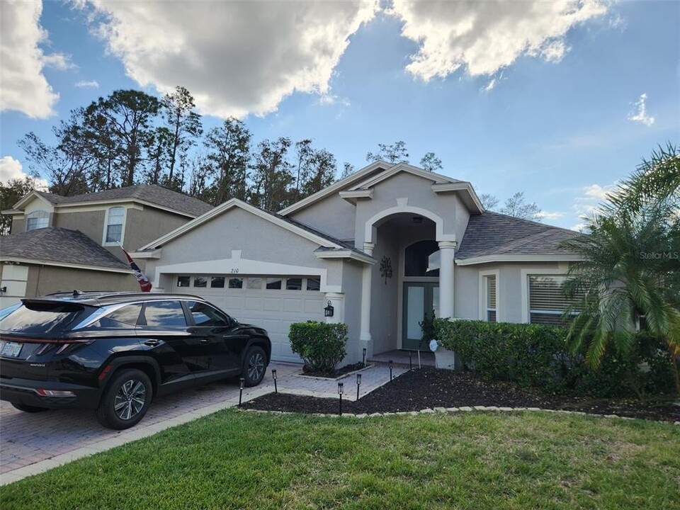 210 Arbor Woods Cir in Oldsmar, FL - Building Photo