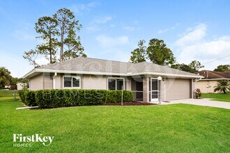 1408 Flora Ave N in Lehigh Acres, FL - Foto de edificio - Building Photo