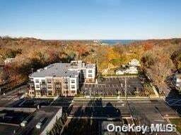 1 N Country Rd, Unit 305 in Port Jefferson, NY - Building Photo