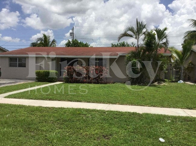 property at 5971 NW 15th St