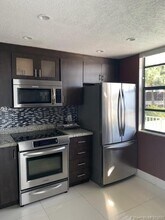 1703 Whitehall Dr-Unit -203 in Davie, FL - Building Photo - Building Photo