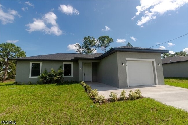 1127 Deauville St E in Lehigh Acres, FL - Building Photo - Building Photo