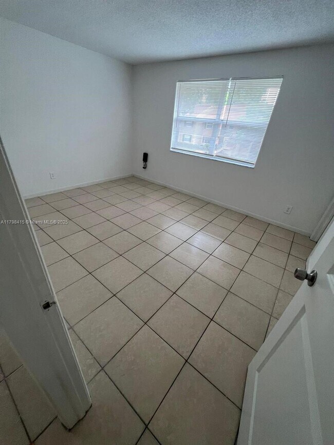property at 10452 NW 8th St