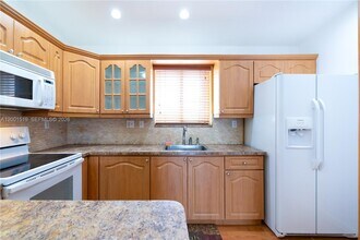 10017 W Okeechobee Rd in Hialeah Gardens, FL - Building Photo - Building Photo