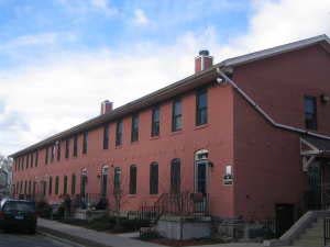 Brick Row Apartments in Willimantic, CT - Building Photo