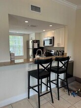 1040 Lake Shore Dr in Lake Park, FL - Building Photo - Building Photo