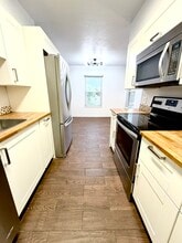3121 S Tamarac Dr, Unit J306 in Denver, CO - Building Photo - Building Photo