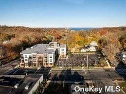 1 N Country Rd, Unit 305 in Port Jefferson, NY - Building Photo