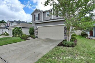 9677 Bridgeway Ave in Jacksonville, FL - Foto de edificio - Building Photo