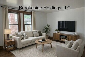 33 Washington St, Unit 1 in Sparta, MI - Foto de edificio - Building Photo