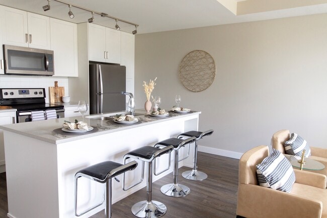 North & South Village Suites Apartments in Abbotsford, BC - Building Photo - Building Photo