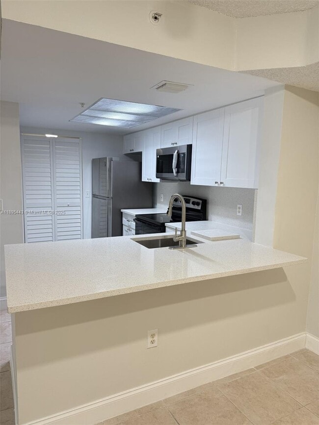 5015 Wiles Rd in Coconut Creek, FL - Building Photo - Building Photo