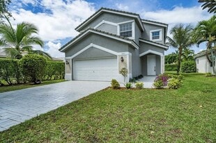 7803 NW 70th Ave in Parkland, FL - Building Photo