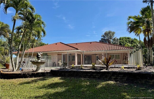 property at 4881 SW Lake Grove Cir