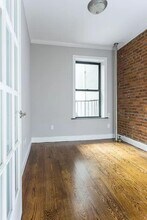 75 Kenmare St in New York, NY - Building Photo - Building Photo