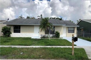 5865 Aurora Ct in Greenacres, FL - Building Photo