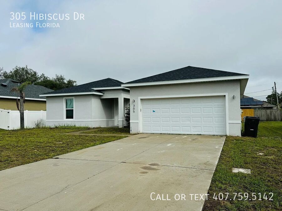 305 Hibiscus Dr in Poinciana, FL - Building Photo