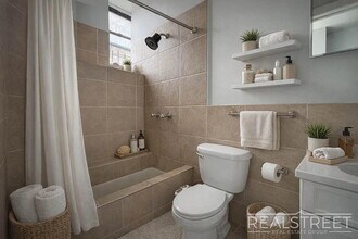 Spacious 1.5-Bedroom Penthouse Apartment in Prime Bushwick! in Brooklyn, NY - Building Photo - Building Photo