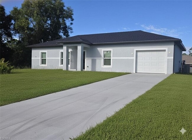 324 Mangonia Ave in Lehigh Acres, FL - Building Photo - Building Photo