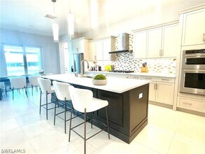 14319 Laguna Spgs Ln in Naples, FL - Building Photo - Building Photo