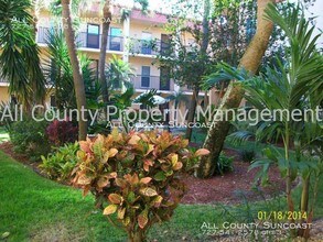 8911 Blind Pass Rd-Unit -111 in St Pete Beach, FL - Building Photo - Building Photo