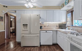 6 Fernwood Terrace N in Stewart Manor, NY - Building Photo - Building Photo