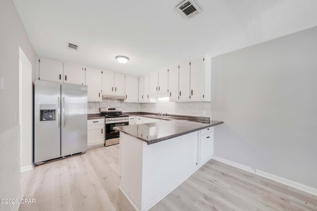 7011 Lois St in Panama City, FL - Building Photo - Building Photo