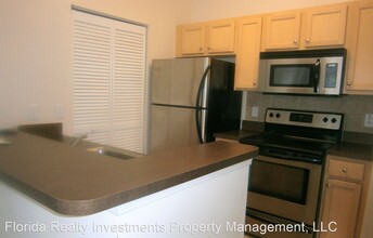 12825 Madison Pointe Cir-Unit -4-206 in Orlando, FL - Building Photo - Building Photo