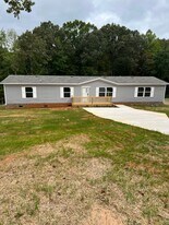 707 Sharon Ln in Iron Station, NC - Building Photo