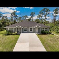 12007 Henley Ave in Port Charlotte, FL - Building Photo