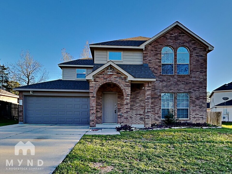 14128 Broken Arrow Dr in Willis, TX - Building Photo