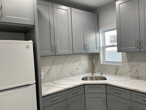10729 104th St, Unit G in Ozone Park, NY - Building Photo - Building Photo