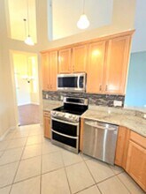 Lakefront home very spacious with a screened in pool in Heathrow in Lake Mary, FL - Building Photo - Building Photo