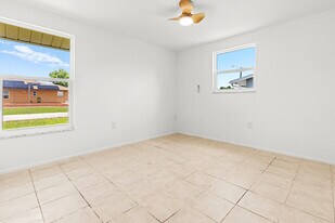 1057 Tropical Ave NW in Port Charlotte, FL - Building Photo