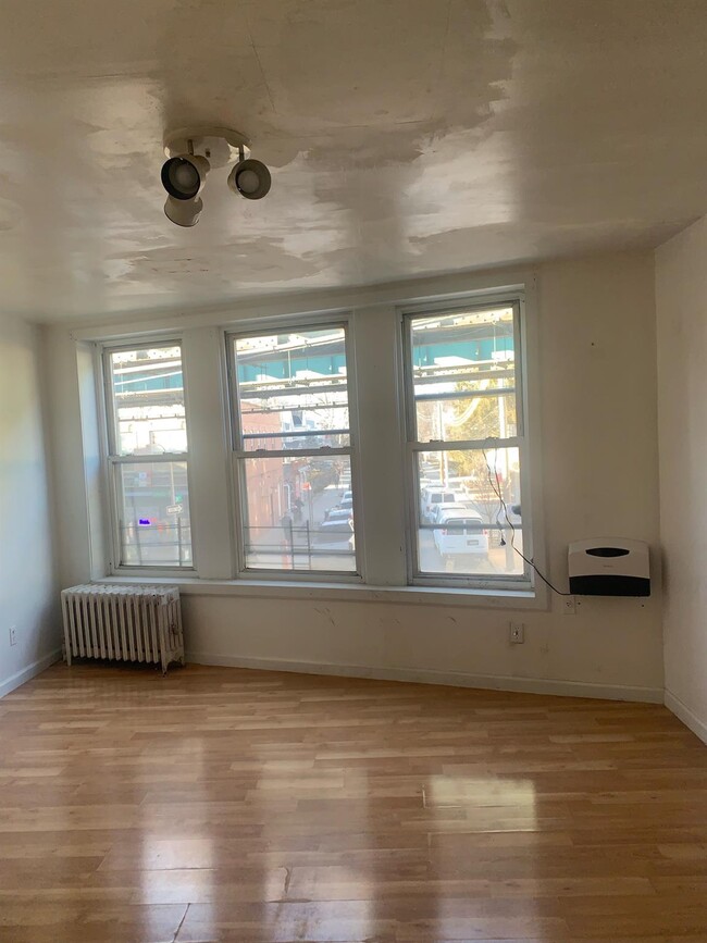 property at 104-12 Jamaica Ave