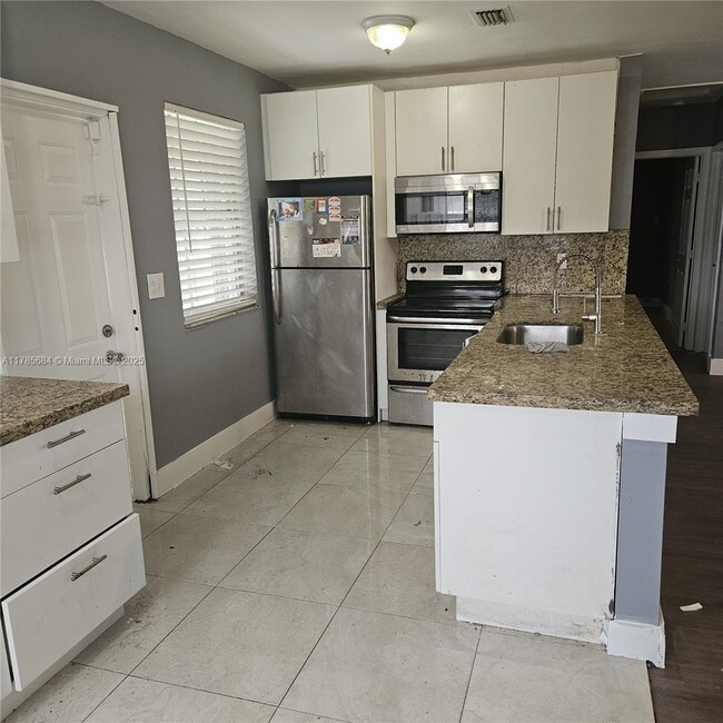 property at 16115 NW 42nd Ave