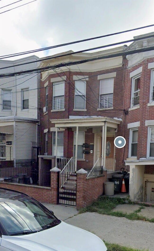 property at 102-06 32nd Ave