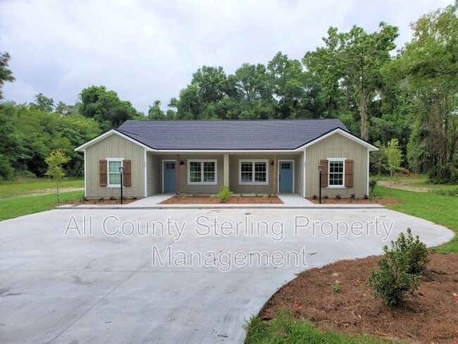 property at 161 SW Yulan St