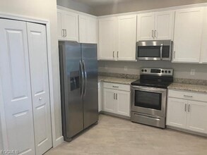 13981 Winding Cedar Wy in Miromar Lakes, FL - Building Photo - Building Photo