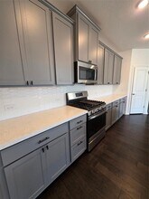 561 Pepperbark Loop in Mustang Ridge, TX - Building Photo - Building Photo